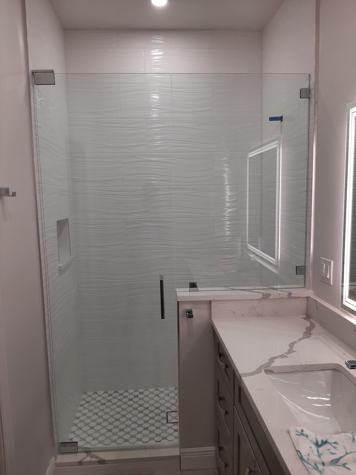 Pivot style glass shower door